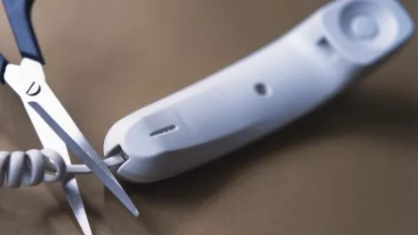Phone cord being cut